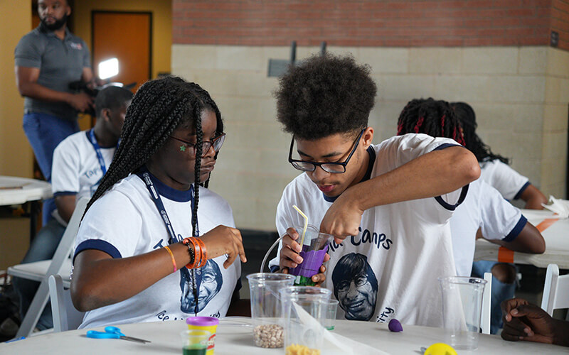 Students building reservoirs