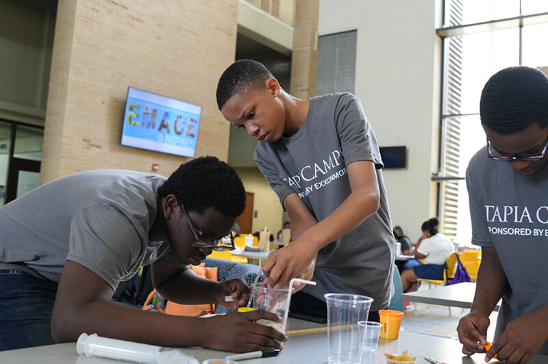 Students building reservoirs