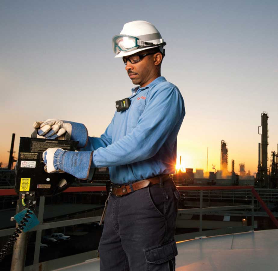 ExxonMobil Pipeline Company worker using equipment