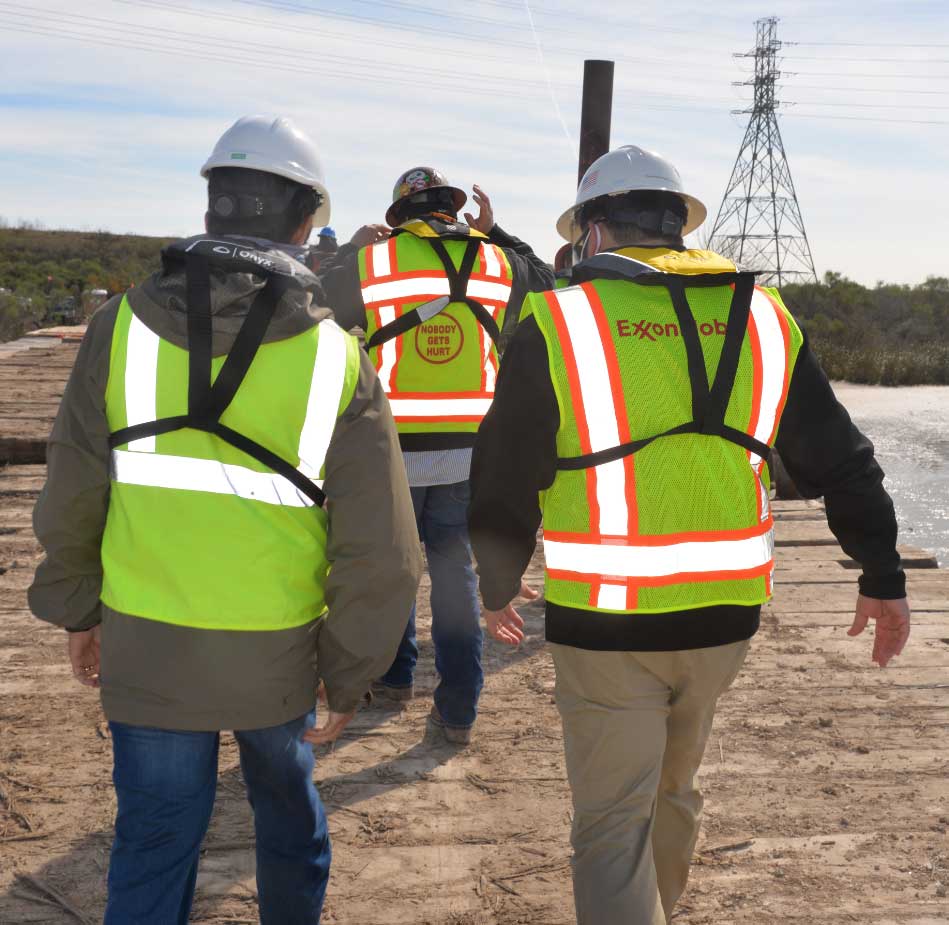 ExxonMobil Pipeline Company employees inspecting project area